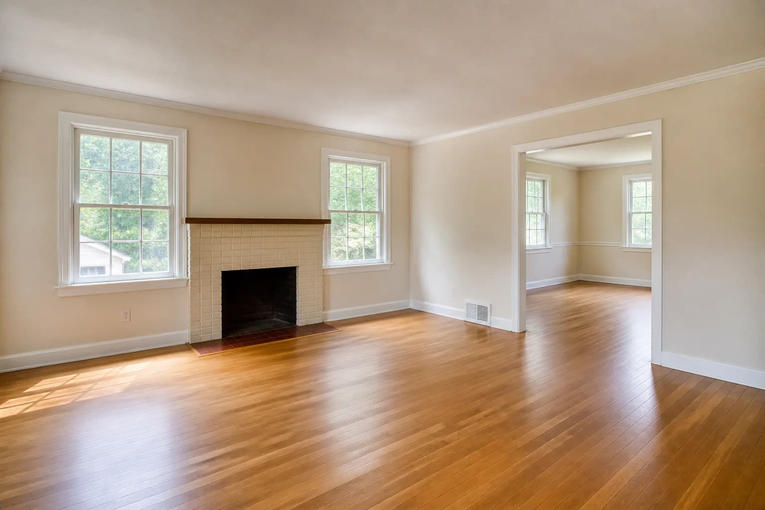 AI-generated demonstration of an empty living room before virtual staging